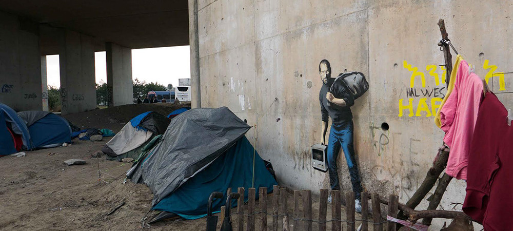 Steve Jobs ritratto in Siria su un graffito di Bansky.